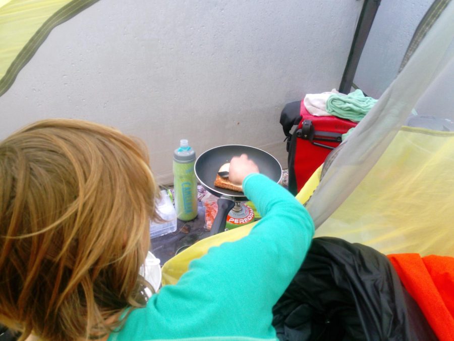 Cold weather camping cooking in tent